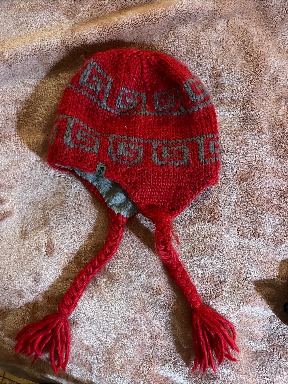 North Face Red Knit Earflap Hat with Gray Pattern